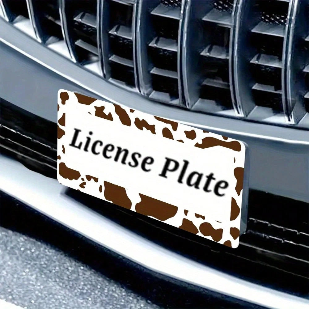 2D Flat Design, Single Piece, For Decorative Purposes Only, Featuring A Cow Pattern License Plate Frame With An Attractive Animal Design On A White Background, Complete With Black Spots.This Car Decor