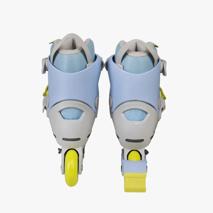 Pair of light blue and gray roller skates with yellow wheels on a white background