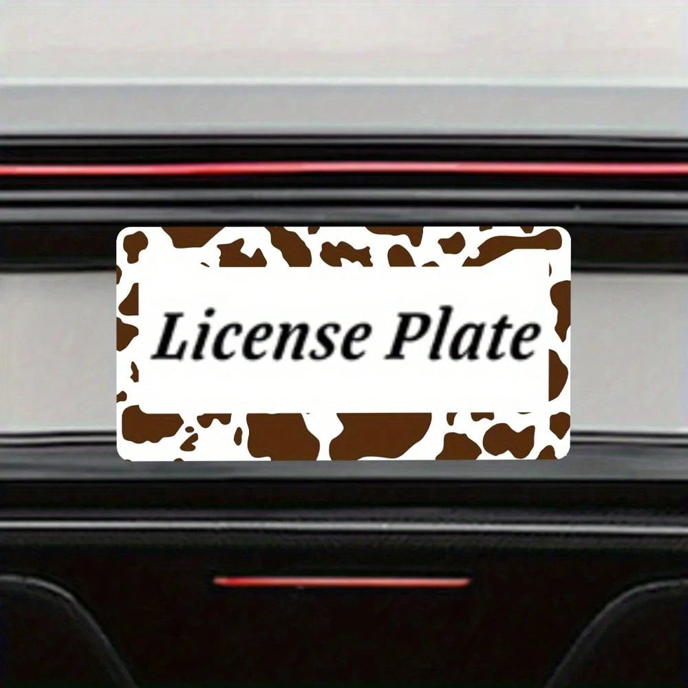 2D Flat Design, Single Piece, For Decorative Purposes Only, Featuring A Cow Pattern License Plate Frame With An Attractive Animal Design On A White Background, Complete With Black Spots.This Car Decor