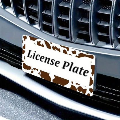 2D Flat Design, Single Piece, For Decorative Purposes Only, Featuring A Cow Pattern License Plate Frame With An Attractive Animal Design On A White Background, Complete With Black Spots.This Car Decor