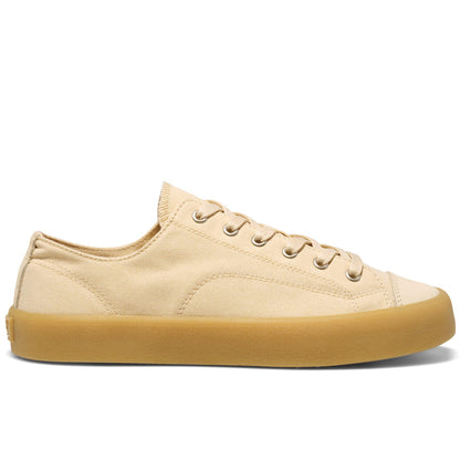 Beige low-top sneaker with a tan sole on a white background.