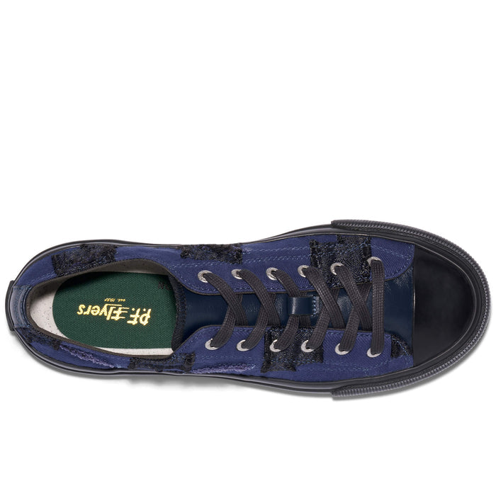 Blue sneaker with black laces on a white background