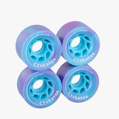 Four blue and purple C7skates wheels on a white background