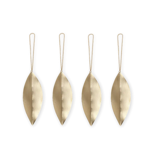 Four brass leaf-shaped ornaments with strings on a white background