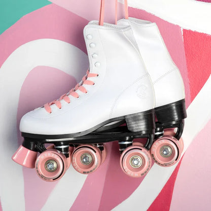 White roller skates with pink wheels on a colorful background