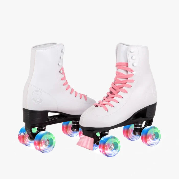 White roller skates with pink laces and colorful wheels on a white background