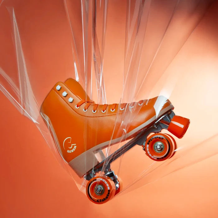 Orange roller skate with clear ribbon on an orange background featuring the brand 'C7Skates'