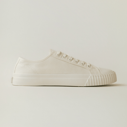 White low-top sneaker on a light background.