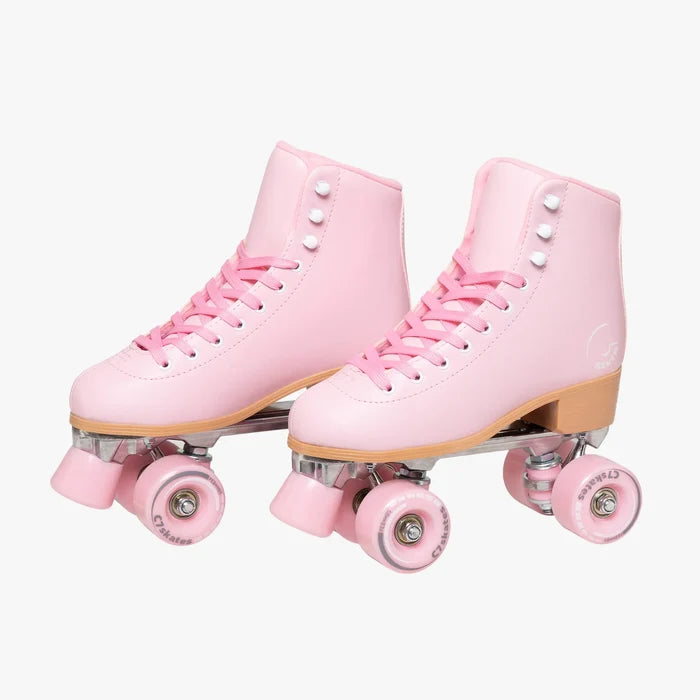 Pair of pink roller skates on a white background