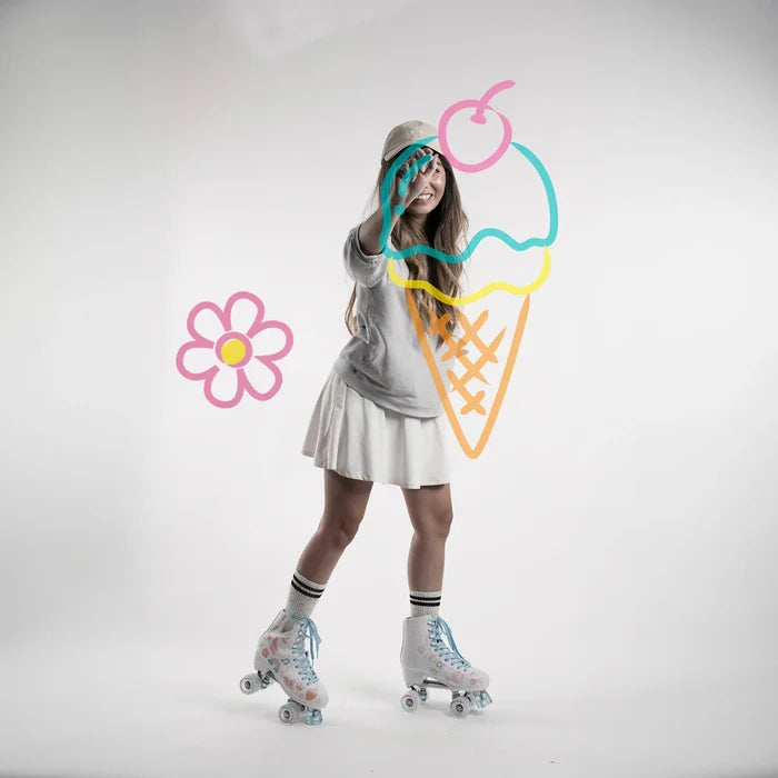 Person wearing roller skates with colorful ice cream cone and flower graphics on a white background