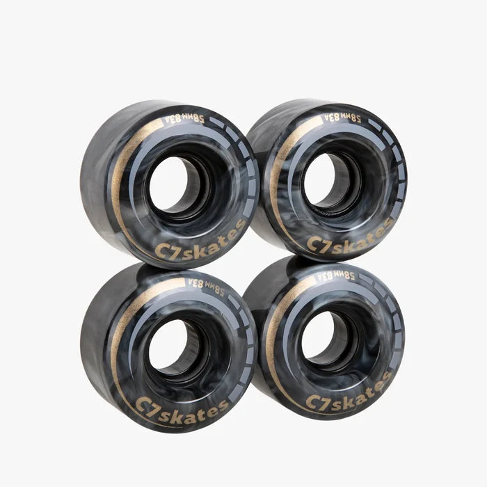 Four C7 skates wheels on a white background