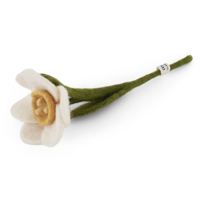 small white felt flower with yellow center and green stem