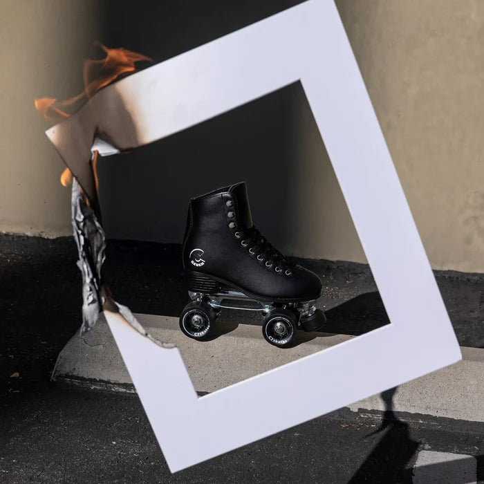 Black roller skate on a reflective surface with a white geometric frame and abstract elements.