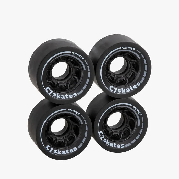 Four black C7 skates wheels on a white background