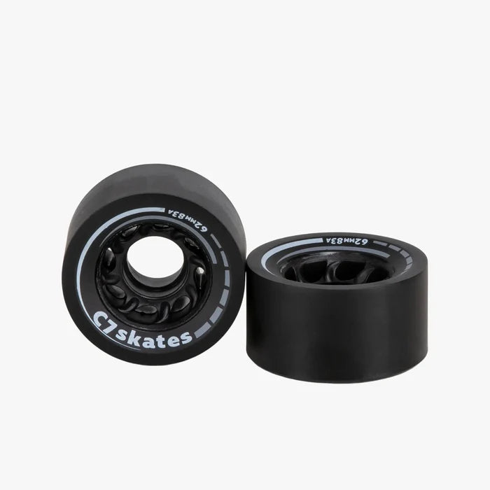 Two black skateboard wheels with bearings on a white background