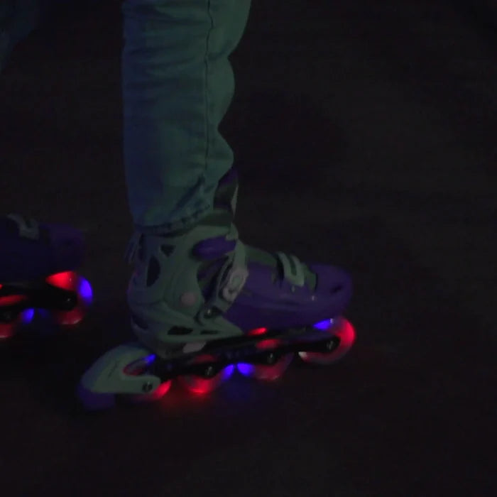 Roller skates with glowing red and blue lights on a dark background