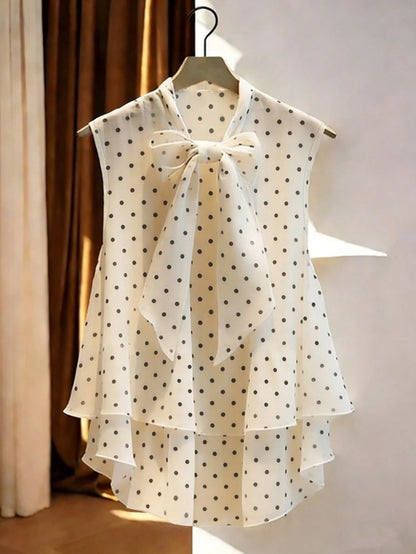 GlowEve Women's Polka Dot Print Tie Collar Ruffle Hem Sleeveless Blouse