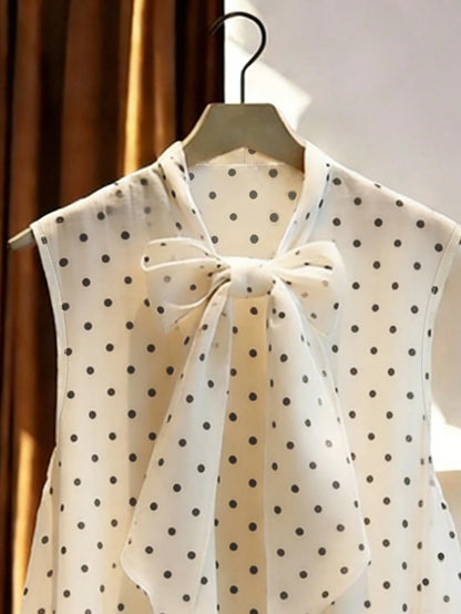 GlowEve Women's Polka Dot Print Tie Collar Ruffle Hem Sleeveless Blouse