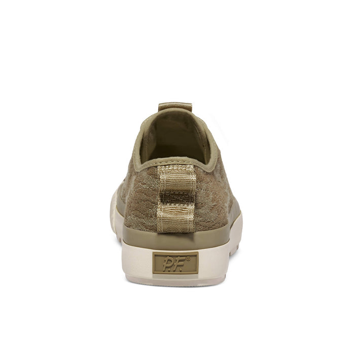 A tan camo-patterned low-top sneaker shown on a white background.