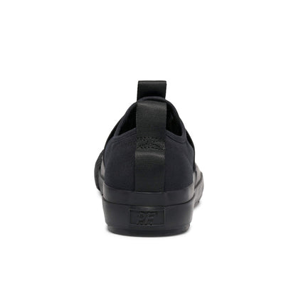Black slip-on sneaker on a white background