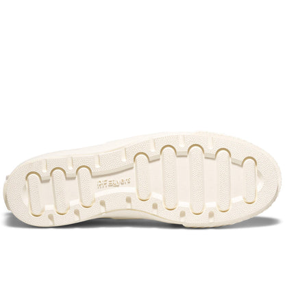 Close-up of a white shoe sole with brand name on a white background