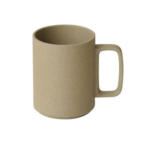 Beige mug with handle on a white background