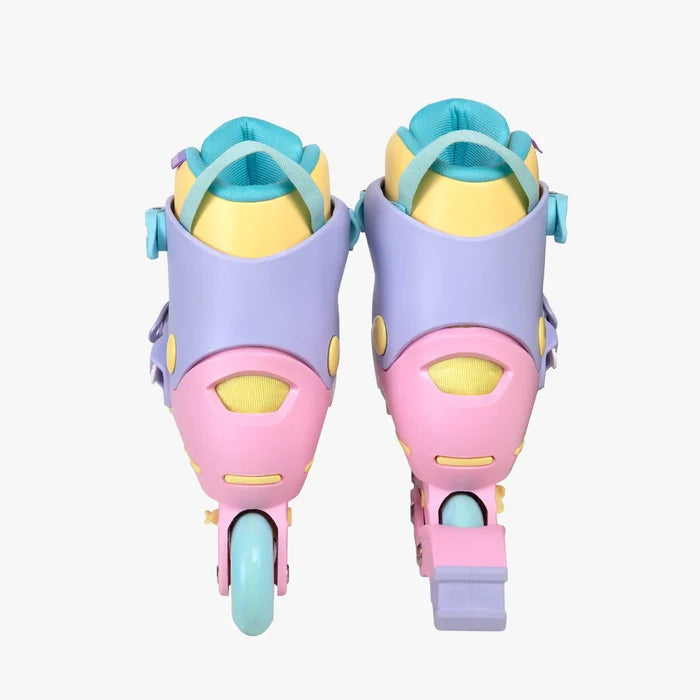 Pair of colorful roller skates with pink, yellow, and blue design on a white background