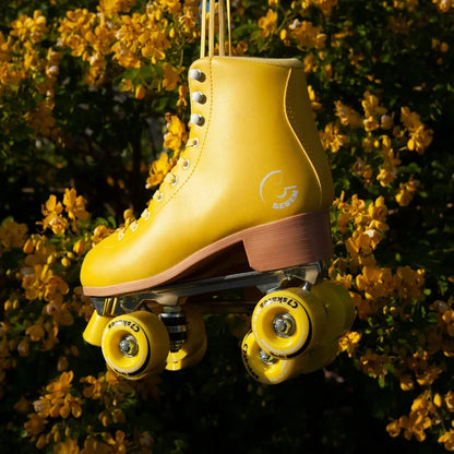 Yellow roller skate with visible brand logo against a floral background