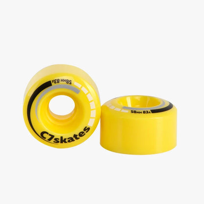 Two yellow C7 skates wheels on a white background