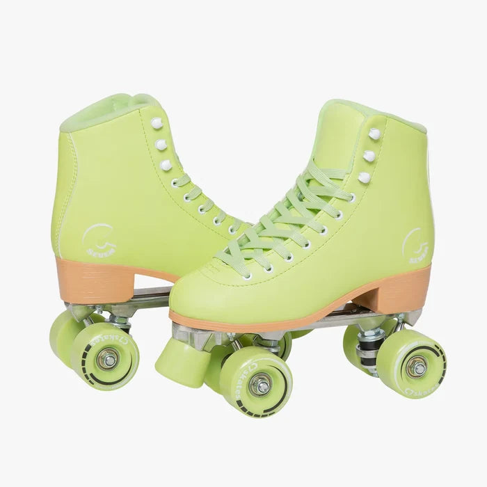 Pair of neon green roller skates with pink accents on a white background