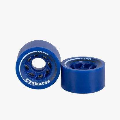 Two blue skateboard wheels with white bearings on a white background