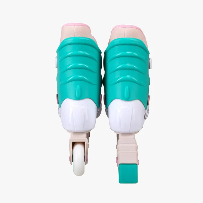 Pair of teal and pink roller skates on a white background