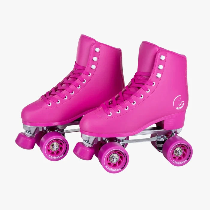 Pink roller skates with purple wheels on a white background