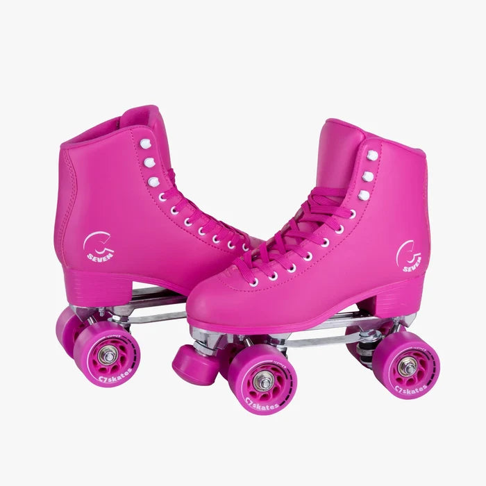 Pair of pink roller skates with visible brand logo on a white background