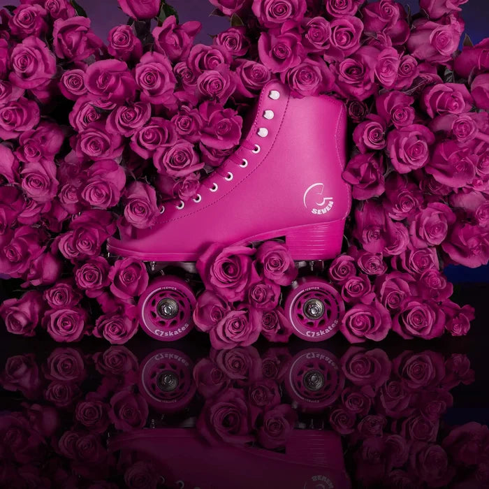 Pink roller skate on a bed of pink roses