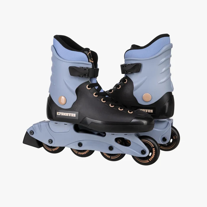 Pair of black and light blue roller skates on a white background