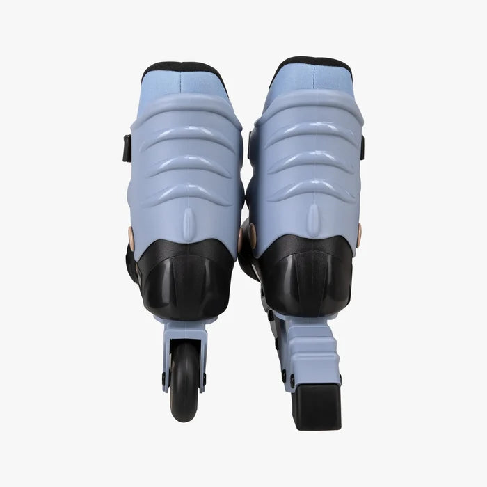 Pair of light blue roller skates with black wheels on a white background