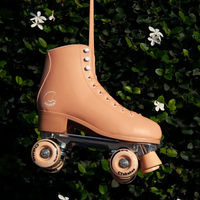 Tan roller skate on a green leafy background