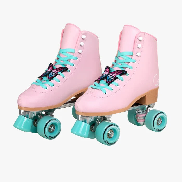 Pink roller skates with turquoise laces and wheels on a white background