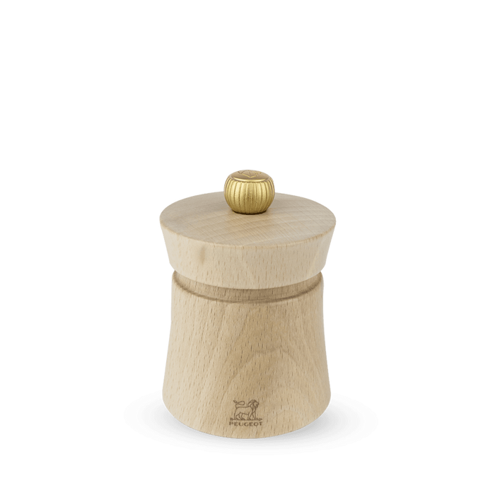 A Peugeot Baya salt grinder made of natural beechwood with a stainless steel knob on top, displayed against a plain background.