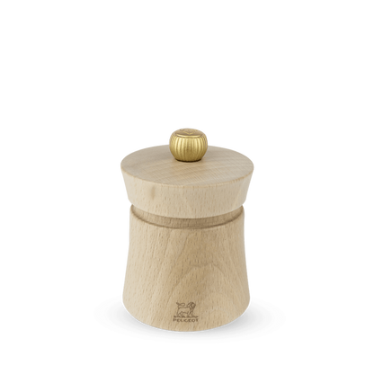 A Peugeot Baya salt grinder made of natural beechwood with a stainless steel knob on top, displayed against a plain background.