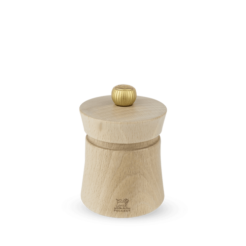 A Peugeot Baya salt grinder made of natural beechwood with a stainless steel knob on top, displayed against a plain background.