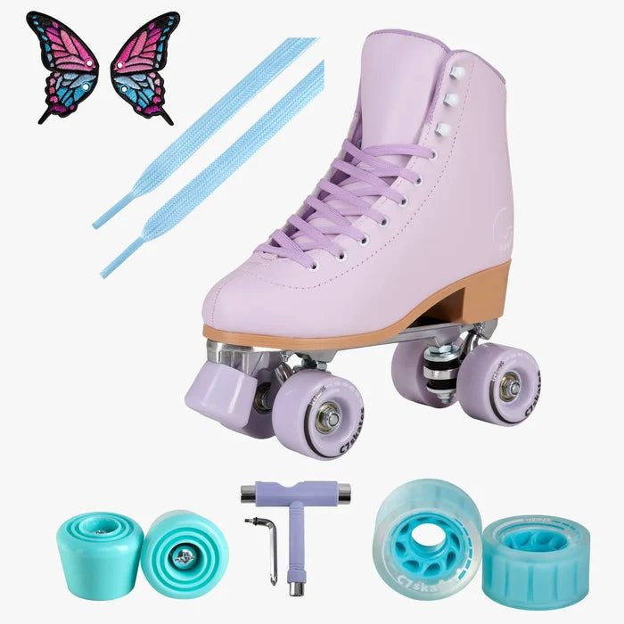 Purple roller skates with accessories on a white background