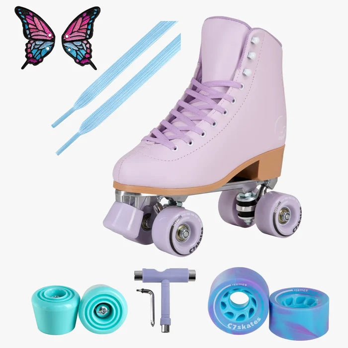 Purple roller skates with accessories on a white background