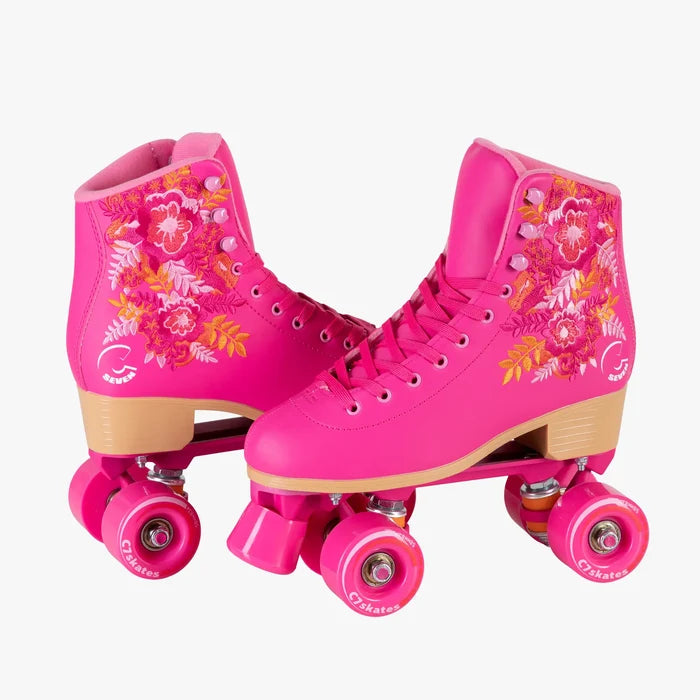 Pink roller skates with floral designs on a white background