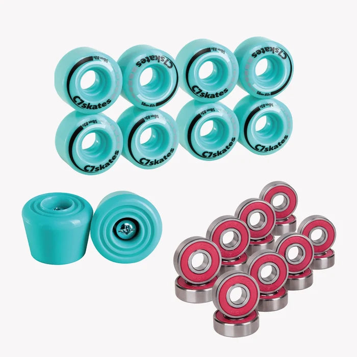 Collection of turquoise roller wheels and pink bearings on a white background