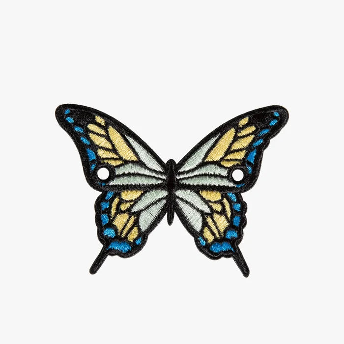 Butterfly-shaped charm with blue and yellow wings on a white background