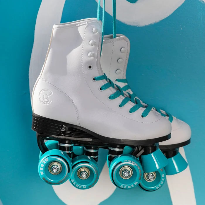White roller skates with turquoise wheels on a blue background