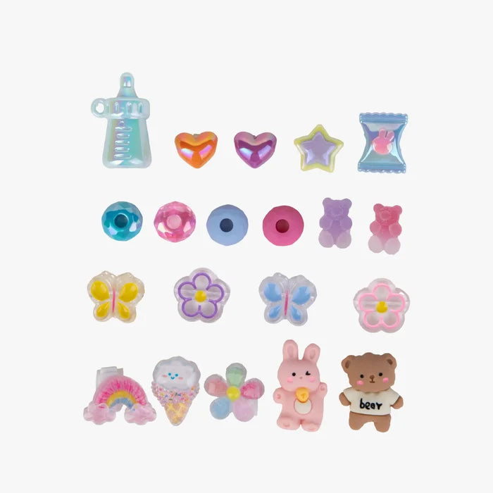 Collection of colorful miniature toys on a white background