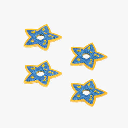 Four blue star-shaped charms with yellow accents on a white background